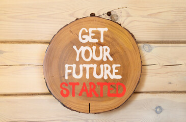 Get your future started symbol. Concept words Get your future started on beautiful wooden circle. Beautiful wooden wall background. Business get your future started concept. Copy space.
