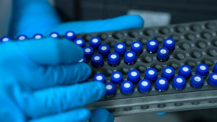 Hplc laboratory science experiment Vials filling inside an autosampler of an HPLC machine inside view in a Scientific experimental laboratory for research development analysis and ipqa test study