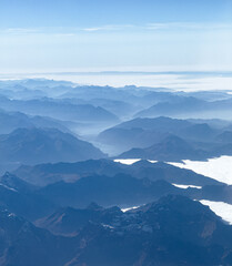 A view of rolling mountains from above the clouds