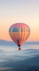 Naklejka premium Colorful hot air balloon floats over serene lake at sunrise in a clear sky