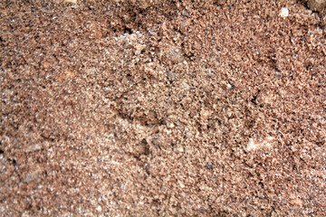 Sand surface with lots of gravel mixed in.