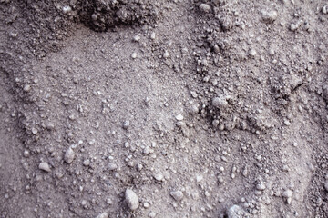 Sand surface with lots of gravel mixed in.