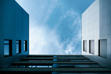 Modern Geometric Facade with Glass and Metal Louvers