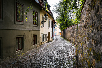 Historic street in Old Town in Prague, Weathered Pastel Walls, Autumn