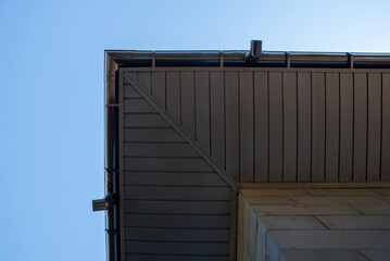 Fototapeta premium Metal soffit on roof overhang with gutter system