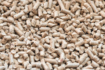 Wood pellets closeup for cat litter, background texture