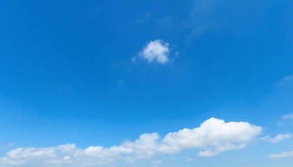 Obraz premium 파란 하늘에 떠있는 구름 한점