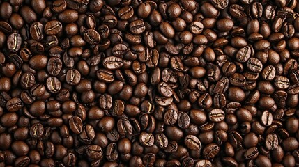 Obraz premium A close-up of roasted coffee beans, showcasing their rich texture and color.