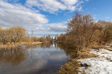 Lake with a cloudy sky in the background