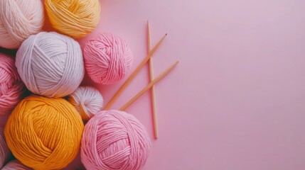 Pastel Yarn Balls and Knitting Needles on Pink Background