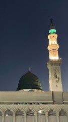 Fototapeta premium The Green Dome and Minaret of the Prophet's Mosque in Medina