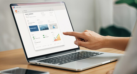 Analyzing digital marketing metrics on laptop screen with interactive dashboard