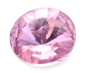 One pink shiny gemstone isolated on white