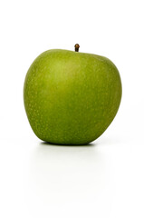 Fresh green apple resting on a clean white surface, capturing the essence of natural simplicity and vibrant health