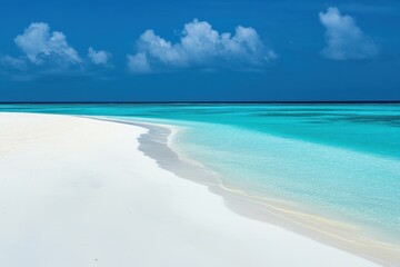 Tranquil beach with white sand and clear turquoise water on a sunny day