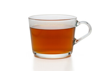 Warm beverage displayed in a clear glass mug on a minimalist background