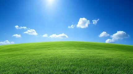 Obraz premium A serene landscape featuring a vibrant green hill under a clear blue sky with fluffy clouds.