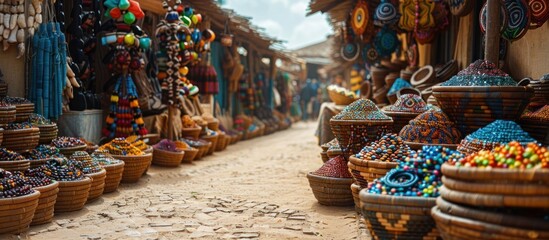 Vibrant African market scene with colorful beads, spices, and handcrafted goods displayed in woven baskets.