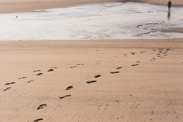 footprints on the beach