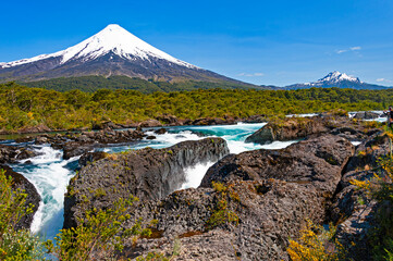 Petrohué Waterfalls (Saltos del Petrohué) in the Vicente Pérez Rosales National Park, with Osorno volcano in the background. © sphraner