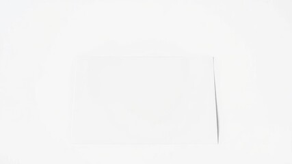 Horizontal greeting card mockup template with a blank white card against a simple background, perfect for showcasing designs or artwork, design, greeting card