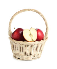 Fresh ripe red apples in wicker basket isolated on white