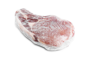 One frozen pork steak in plastic wrap isolated on white
