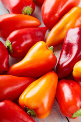Fresh Colored Bell Peppers Arranged on Rustic Wooden Background, Natural Food Concept
