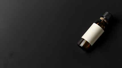 Amber glass bottle with blank label on dark background.