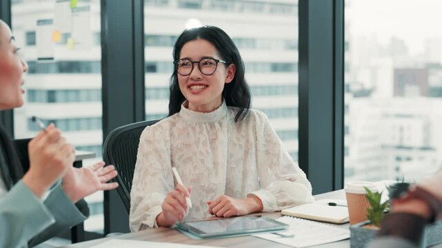 Asian, business women and meeting with tablet for design, project or collaboration together at office. Japan, creative team or graphic designer with technology for company improvement or development