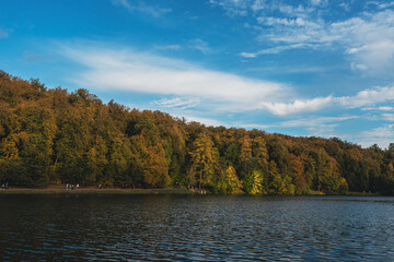 Scenic autumn lake surrounded by vibrant forest