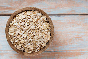Dry Rolled Oats on Wooden Boards for Healthy Vegan Breakfast, Copy Space