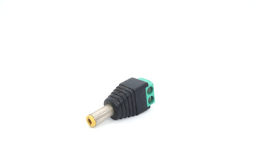 A male DC jack with green screw connection on a white background.
