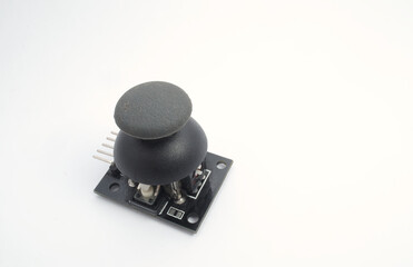 A joystick module with its rubber pads on a white background. Used for electronics and robotics enthusiasts.