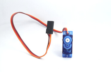 A blue plastic micro servo on a white background. Used by electronics, mechatronics, robotics, and...