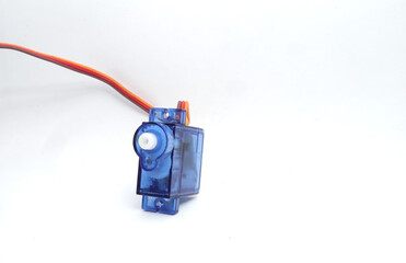 A blue plastic micro servo on a white background. Used by electronics, mechatronics, robotics, and remote control hobbyists.