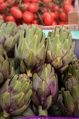 Fototapeta premium Artichokes on a stall at the market, fresh vegetables at the market, healthy eating concept, vegetarian diet, close-up.