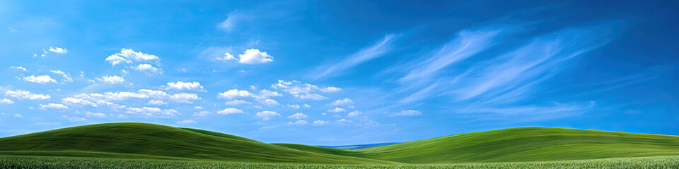 Fototapeta premium A vast open sky above rolling hills, leading the eye to the distant vanishing point.