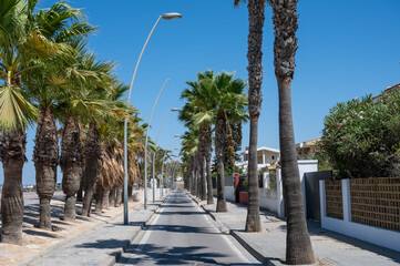 Golden sandy beaches and promenade of Qudalquivir river in Sanlucar de Barrameda, Andalusian town, Spain in summer