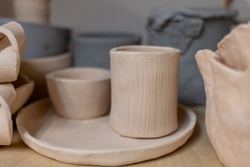 Samples of ceramic art objects and tabelware during workshop in art ceramic atelier in Poland