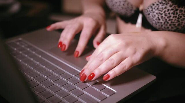 Digital Connection: Webcam User Engaged in Laptop Work, Semi-Nude