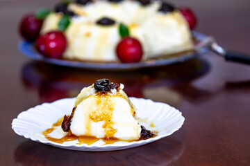 Traditional Brazilian coconut flan dessert known as manjar branco, manjar de coco and manjar dos deuses. Served with plum syrup.