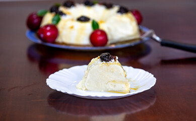 Traditional Brazilian coconut flan dessert known as manjar branco, manjar de coco and manjar dos deuses. Served with plum syrup.