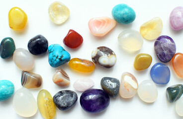 Multicolored healing chakra crystals. Real semi-precious stones: amethyst, rose quartz, agate, turquoise, citrine, apatite.