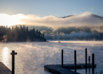 Boat dock on a misty morning lake. Couer d'Alene Lake Idaho. 