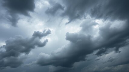 Obraz premium Dark storm clouds looming in the sky, creating a dramatic and ominous atmosphere, ominous, cloudscape