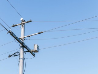 Electricity distribution transformer mounted on utility pole with multiple wires connected, equipment, wires