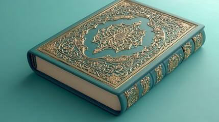 Fototapeta premium A teal book with a gold ornate design on the cover.