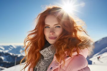 Portrait of a beautiful young woman with curly red hair outdoors in winter