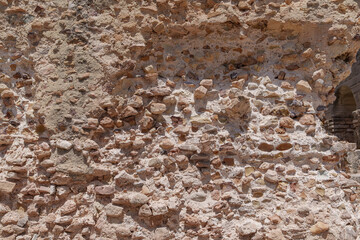 Old brick-shaped stone wall